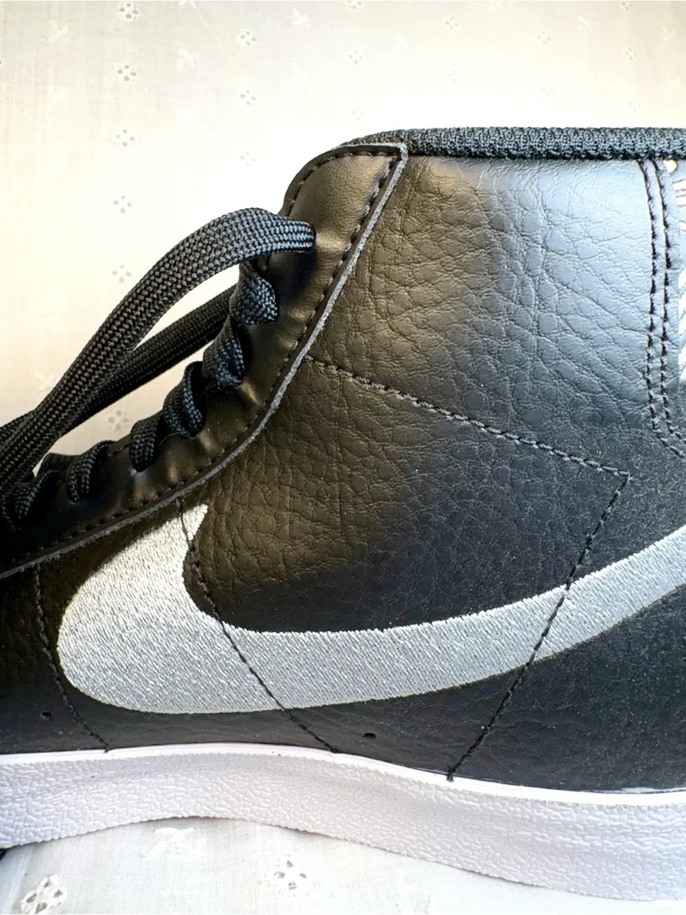 Nike Black High-Top Sneakers with White Tongue Text